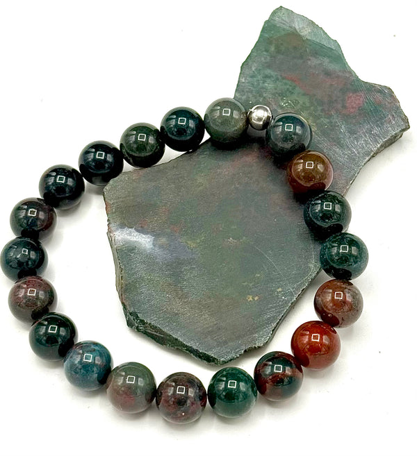 Bloodstone bracelet by STICS and STONES featuring polished round bloodstone beads on an elastic band.
