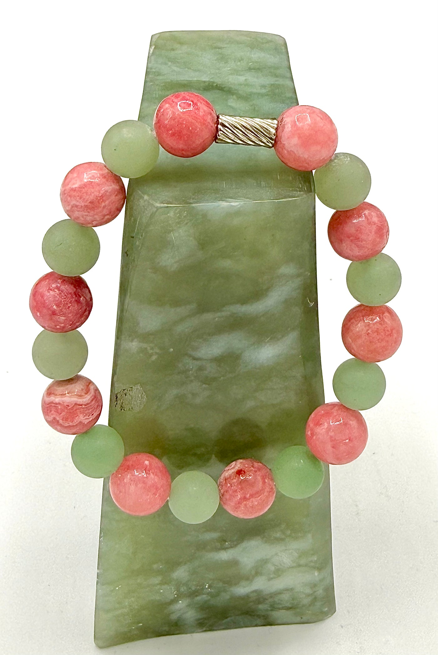 Green Aventurine and Rhodochrosite bracelet featuring polished gemstones on a stretch cord, handcrafted by STICS and STONES.