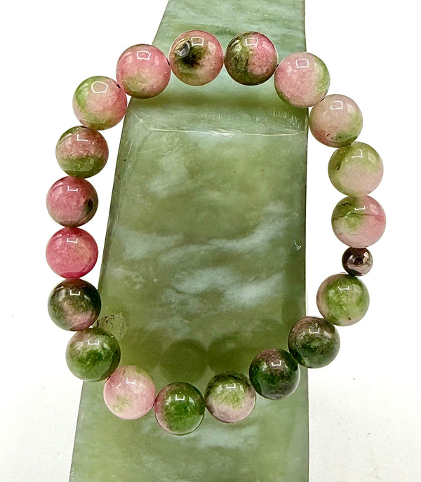 Pink and green dyed quartz bracelet featuring polished stones, designed by STICS and STONES.