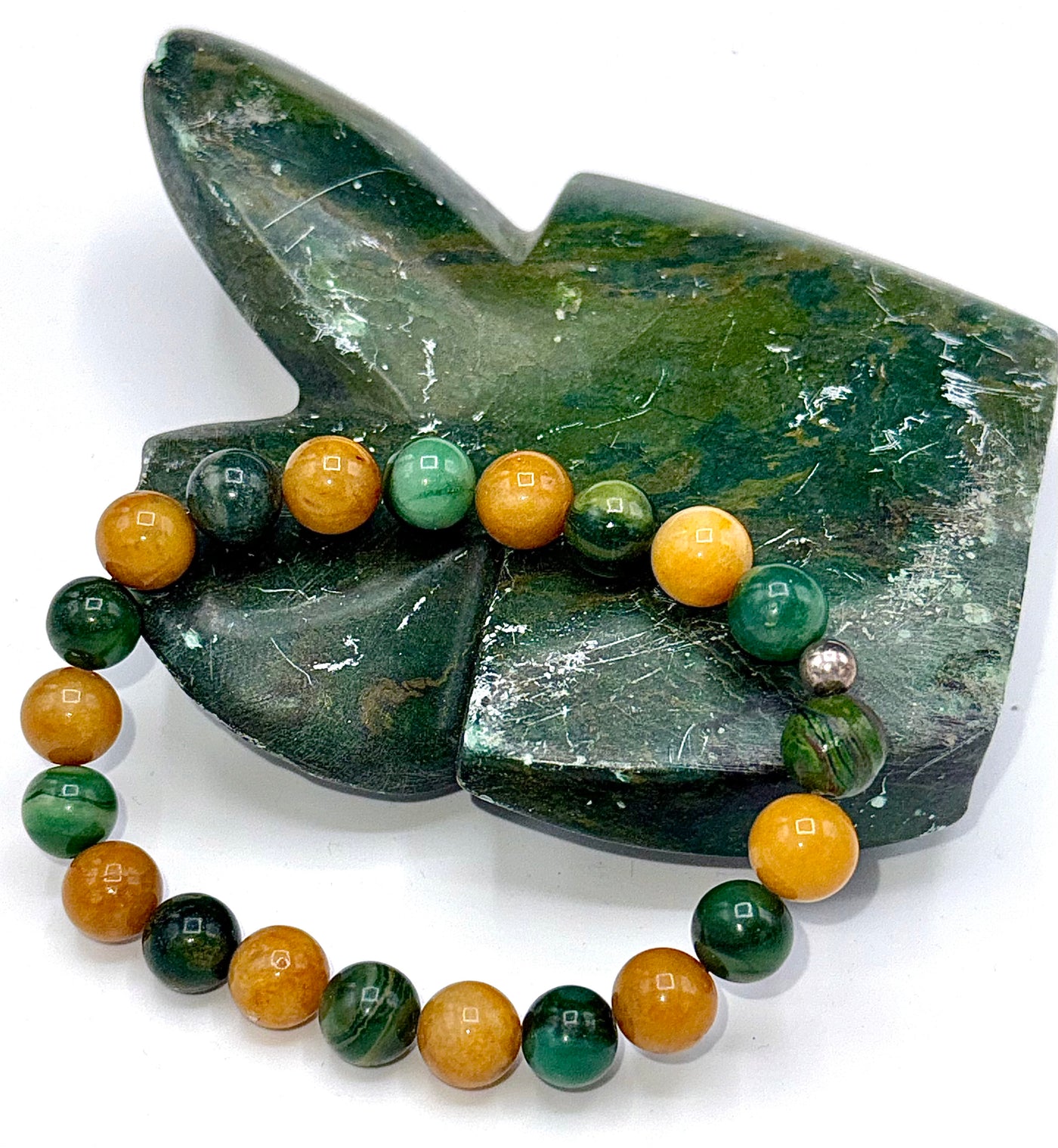 Verdite and yellow jade bracelet featuring natural gemstone beads from STICS and STONES on a neutral background.