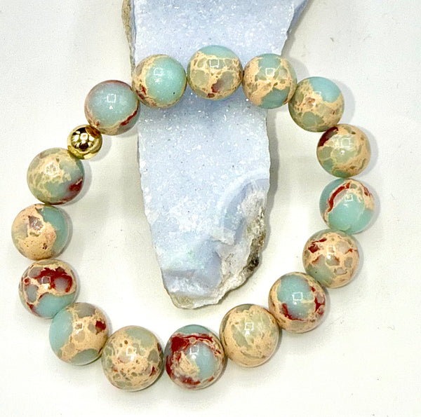 Aqua Terra Jasper bracelet by STICS and STONES featuring polished natural stone beads on an elastic band.