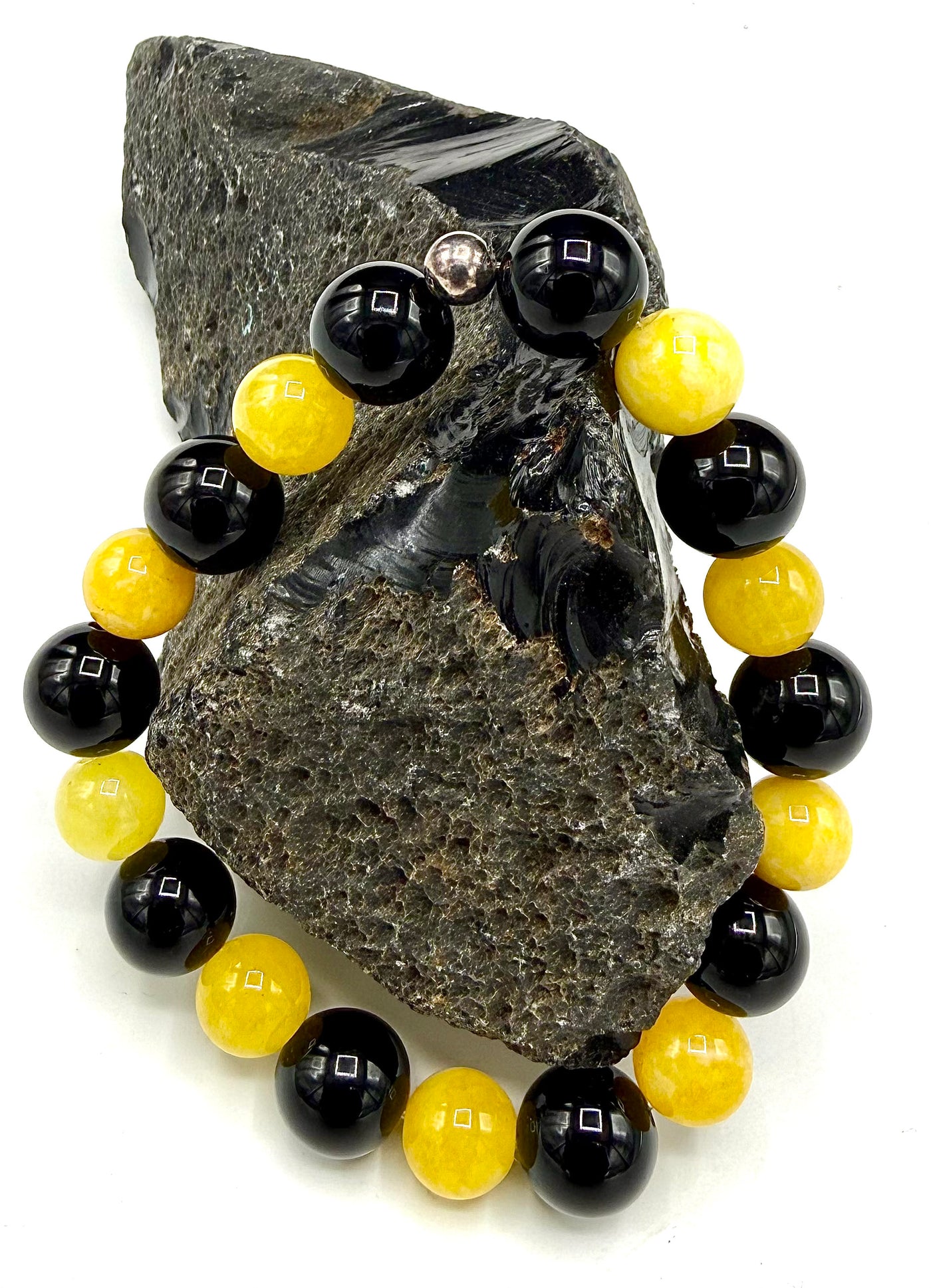 Yellow jade and black onyx bracelet with beaded design from STICS and STONES, featuring polished stone beads.