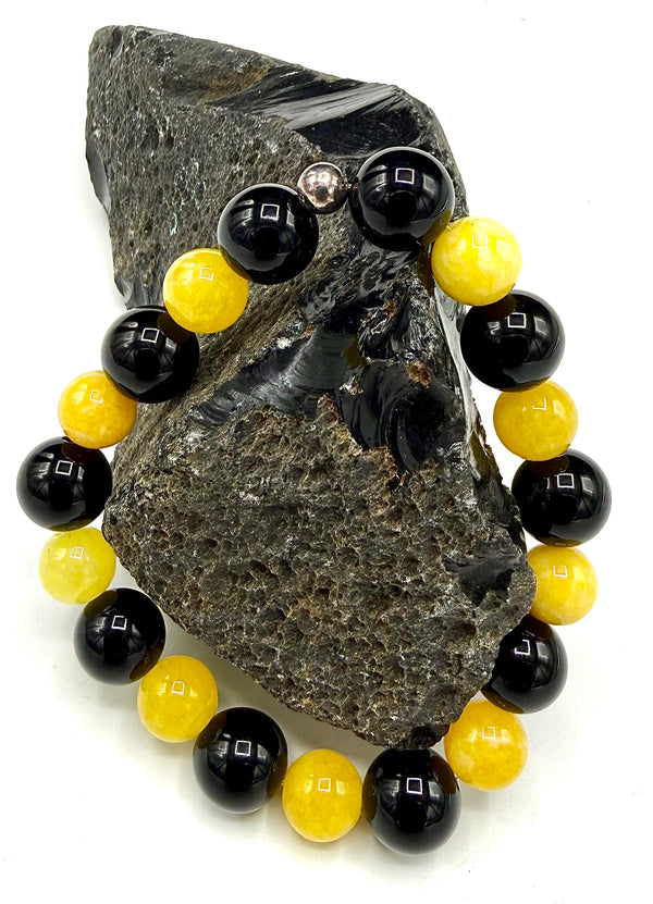 Yellow jade and black onyx bracelet with beaded design from STICS and STONES, featuring polished stone beads.