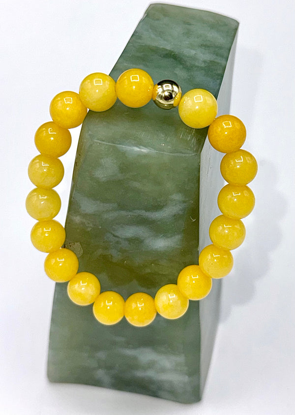 Yellow quartz bracelet featuring smooth, polished stones on an elastic band, crafted by STICS and STONES.