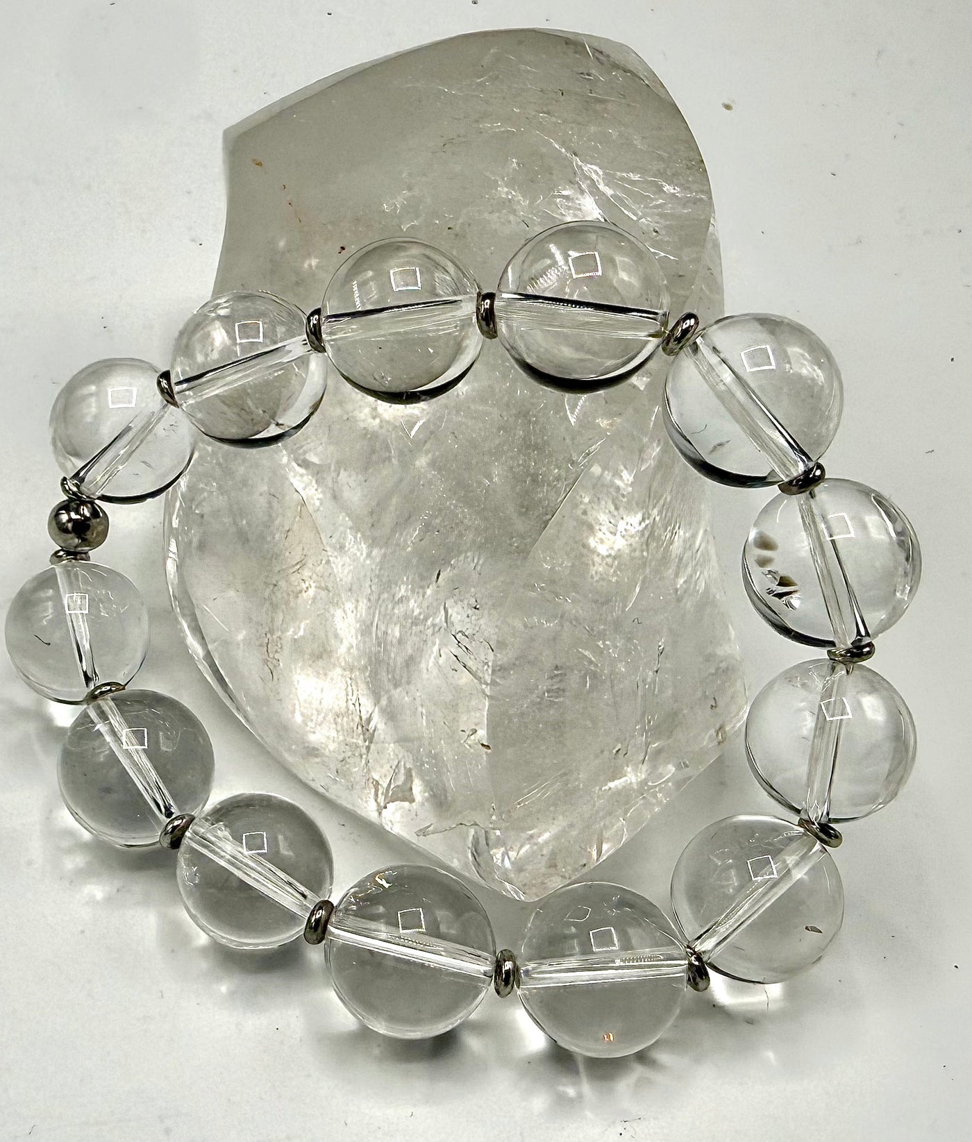 Clear Quartz bracelet from STICS and STONES featuring polished, translucent stones on an elastic band.