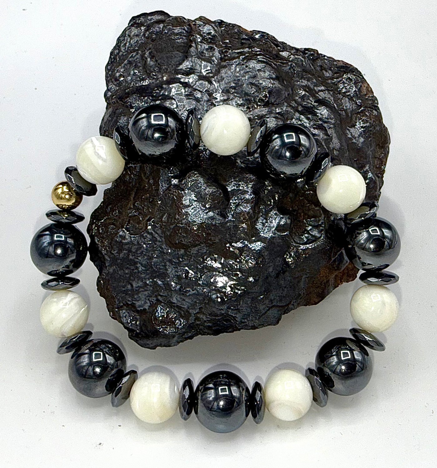 Hematite and pearl bracelet featuring polished hematite beads and elegant pearl accents, designed by STICS and STONES.