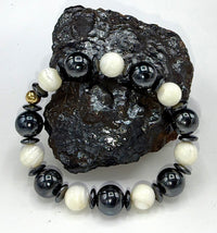 Hematite and pearl bracelet featuring polished hematite beads and elegant pearl accents, designed by STICS and STONES.