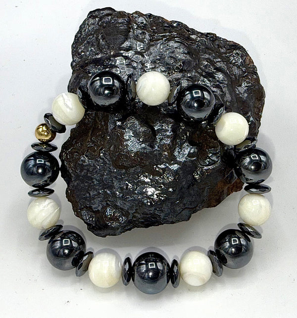 Hematite and pearl bracelet featuring alternating black hematite beads and white pearls, elegant jewelry by STICS and STONES.
