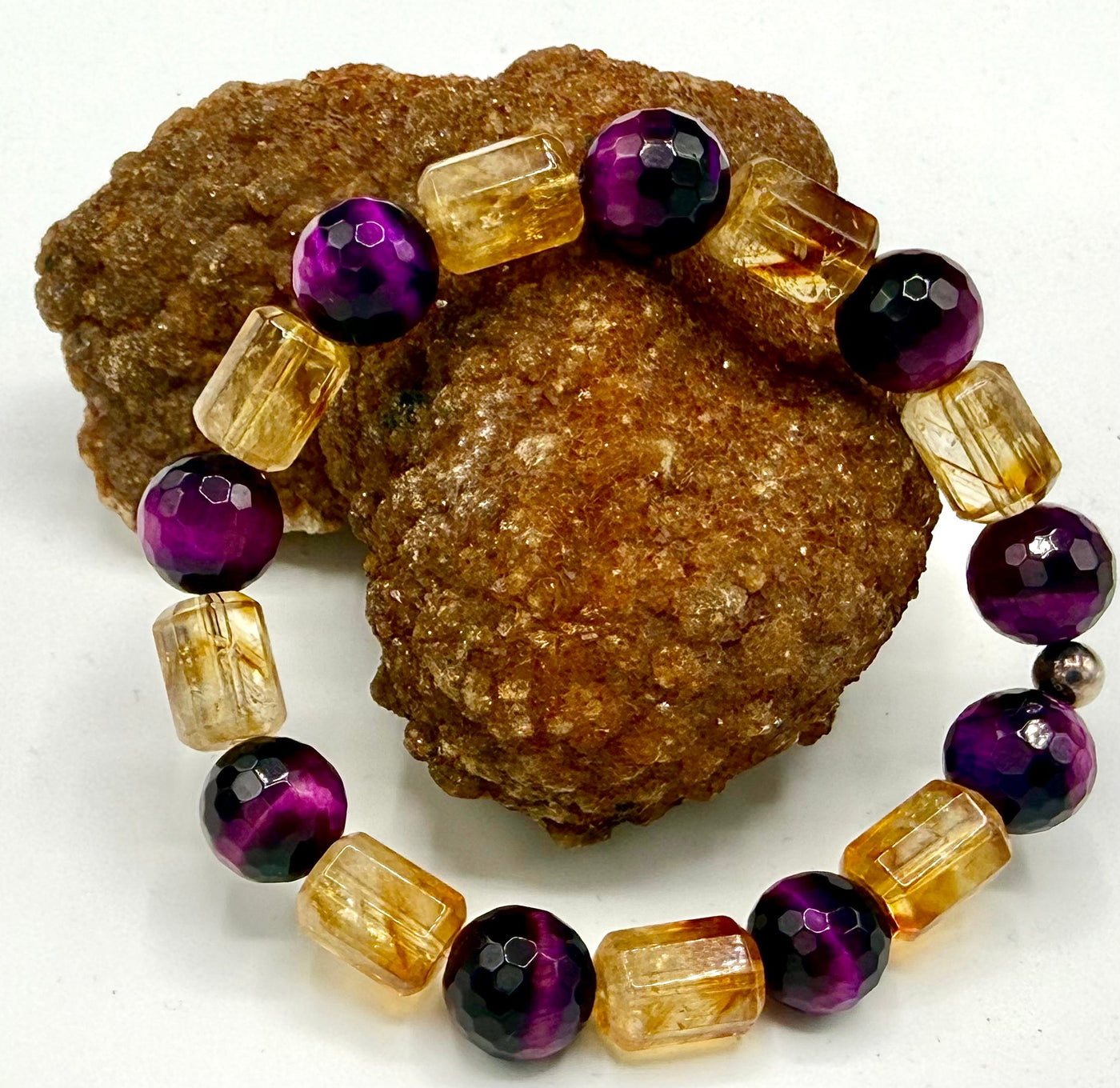 Citrine and purple tiger eye bracelet featuring rectangular beads, crafted by STICS and STONES, on a neutral background.