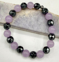 Lavender jade and hematite bracelet featuring smooth beads, designed by STICS and STONES for elegant jewelry styling.