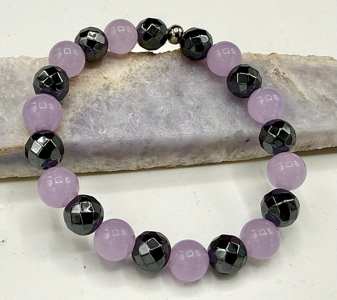 Lavender Jade and Hematite bracelet by STICS and STONES featuring smooth lavender jade beads and shiny hematite accents.