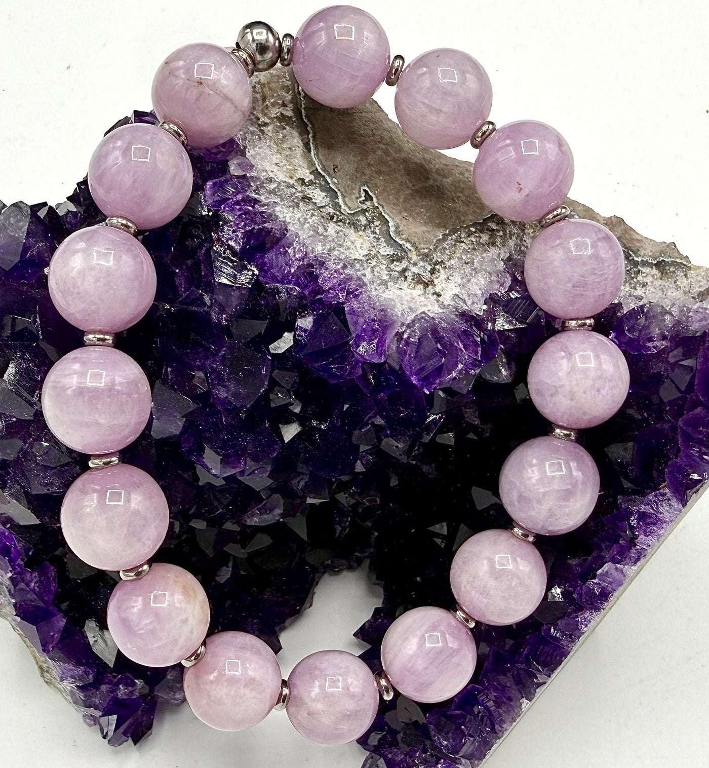 Kunzite bracelet from STICS and STONES featuring pink-purple faceted stones on a delicate silver chain.