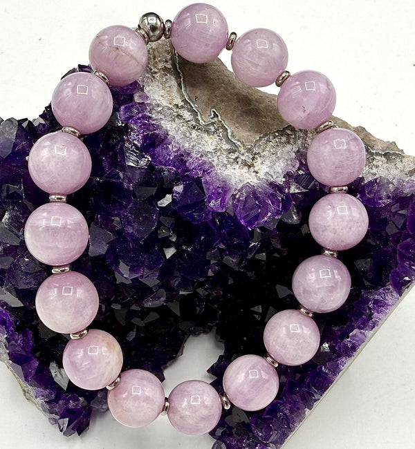 Kunzite bracelet from STICS and STONES featuring pink-purple faceted stones on a delicate silver chain.