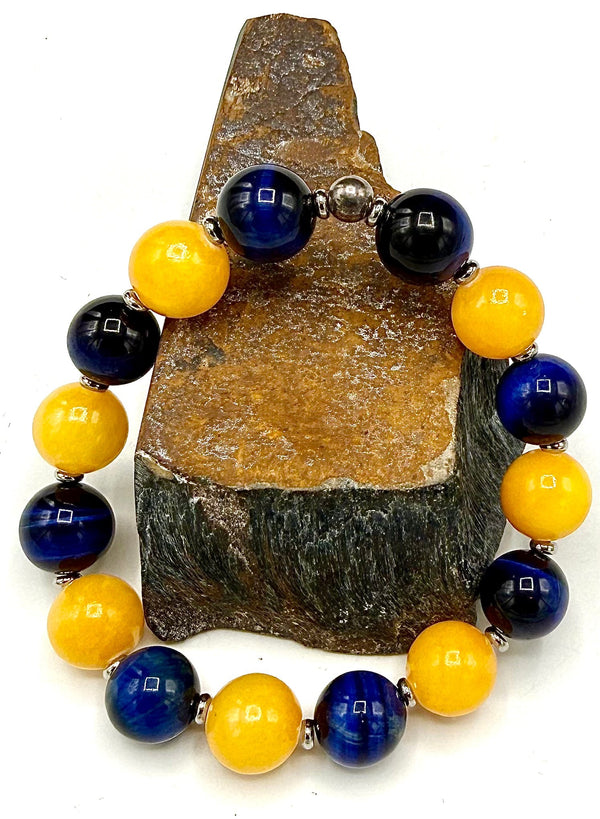 Blue tiger eye and calcite bracelet from STICS and STONES with polished beads and elastic band for stylish wear.