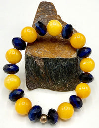 Blue tiger eye and yellow calcite bracelet featuring polished beads from STICS and STONES.