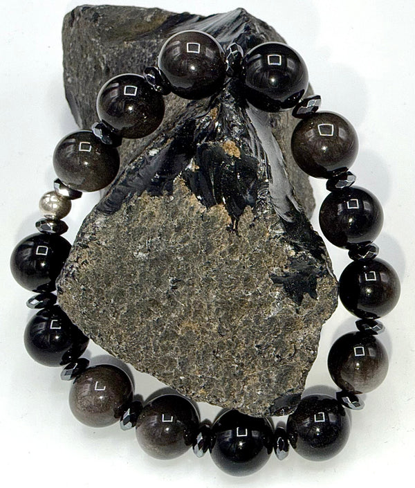 Silver Obsidian bracelet featuring polished black stone beads with silver accents, stylish jewelry by STICS and STONES.