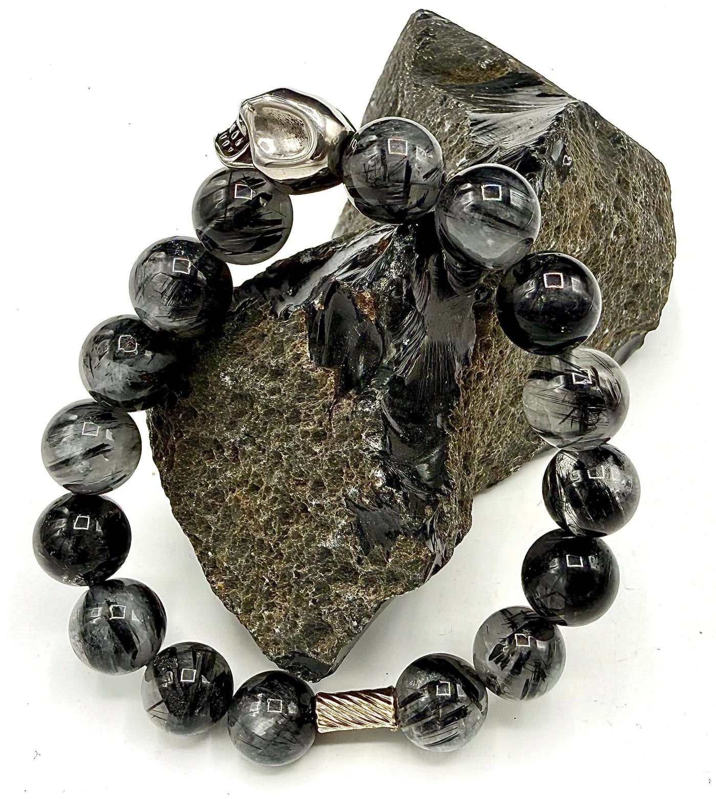 Black Tourmaline Quartz bracelet featuring polished black stones on a stretch band from STICS and STONES.