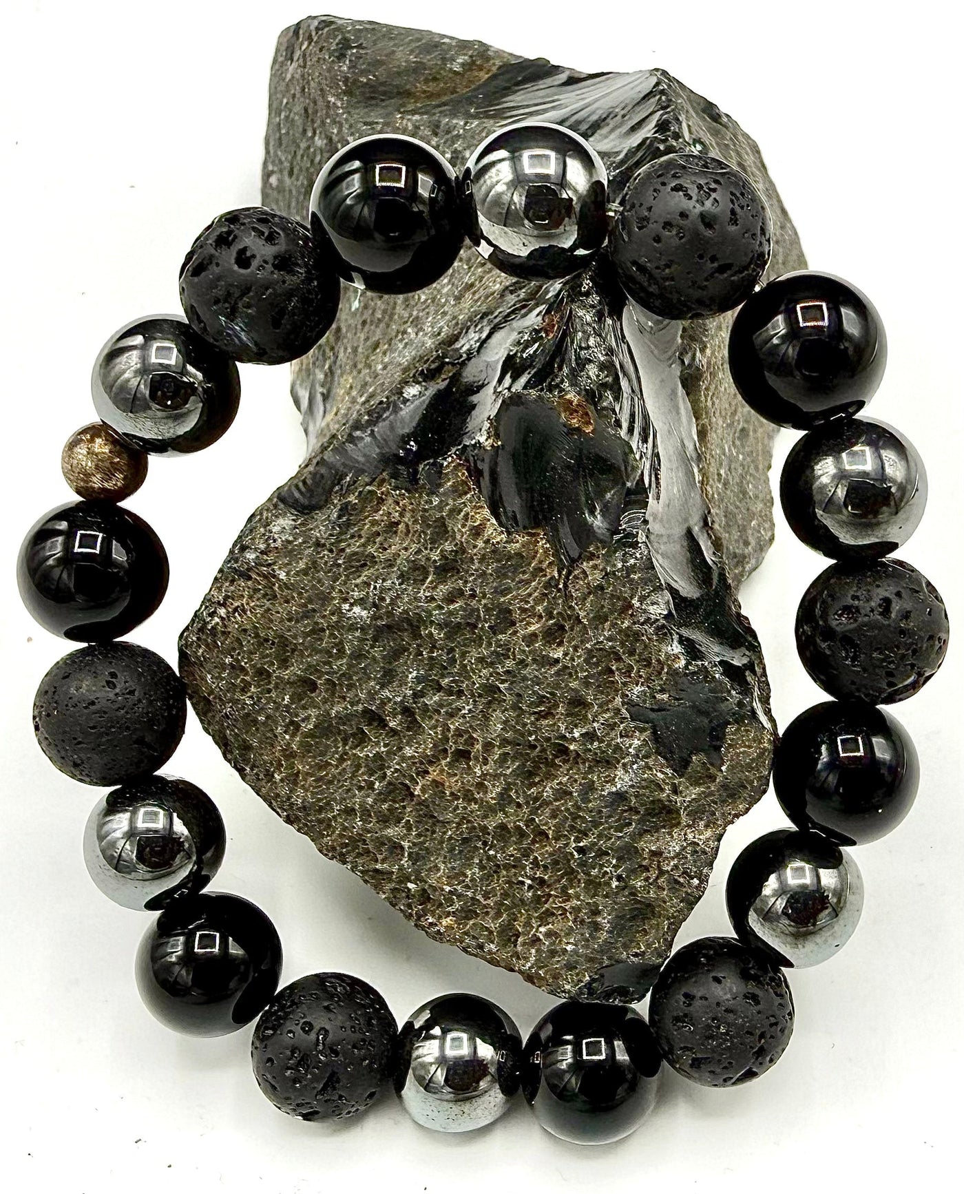 Lava rock and hematite bracelet by STICS and STONES featuring black volcanic stones and shiny hematite beads.