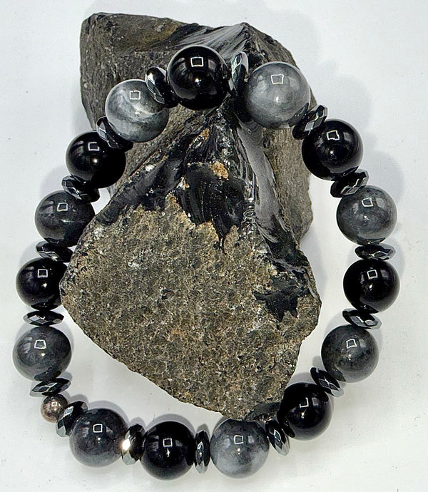 Black and grey cats eye bracelet with smooth beads, stylish jewelry piece from STICS and STONES.
