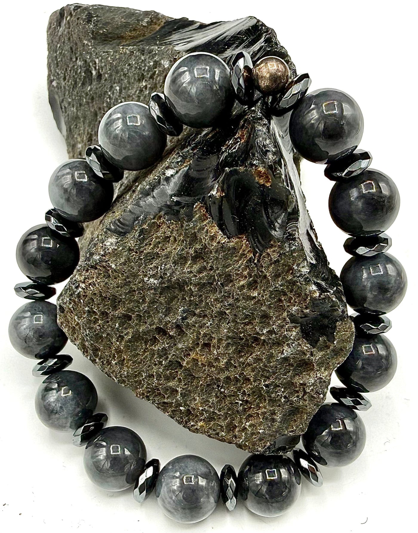 Grey Jade bracelet by STICS and STONES featuring smooth round beads on an elastic cord.