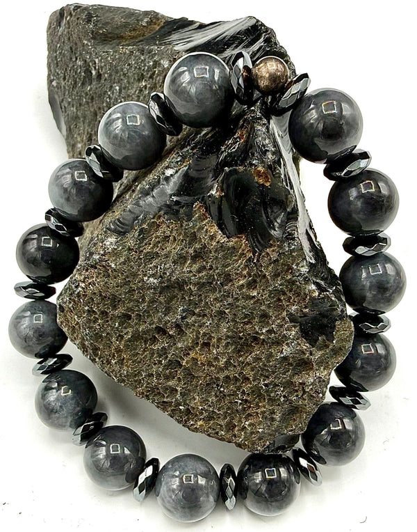 Grey Jade bracelet by STICS and STONES featuring smooth round beads on an elastic cord.