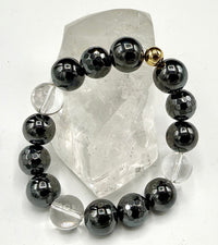 Hematite and quartz bracelet featuring polished black hematite beads and clear quartz stones, stylish jewelry accessory.