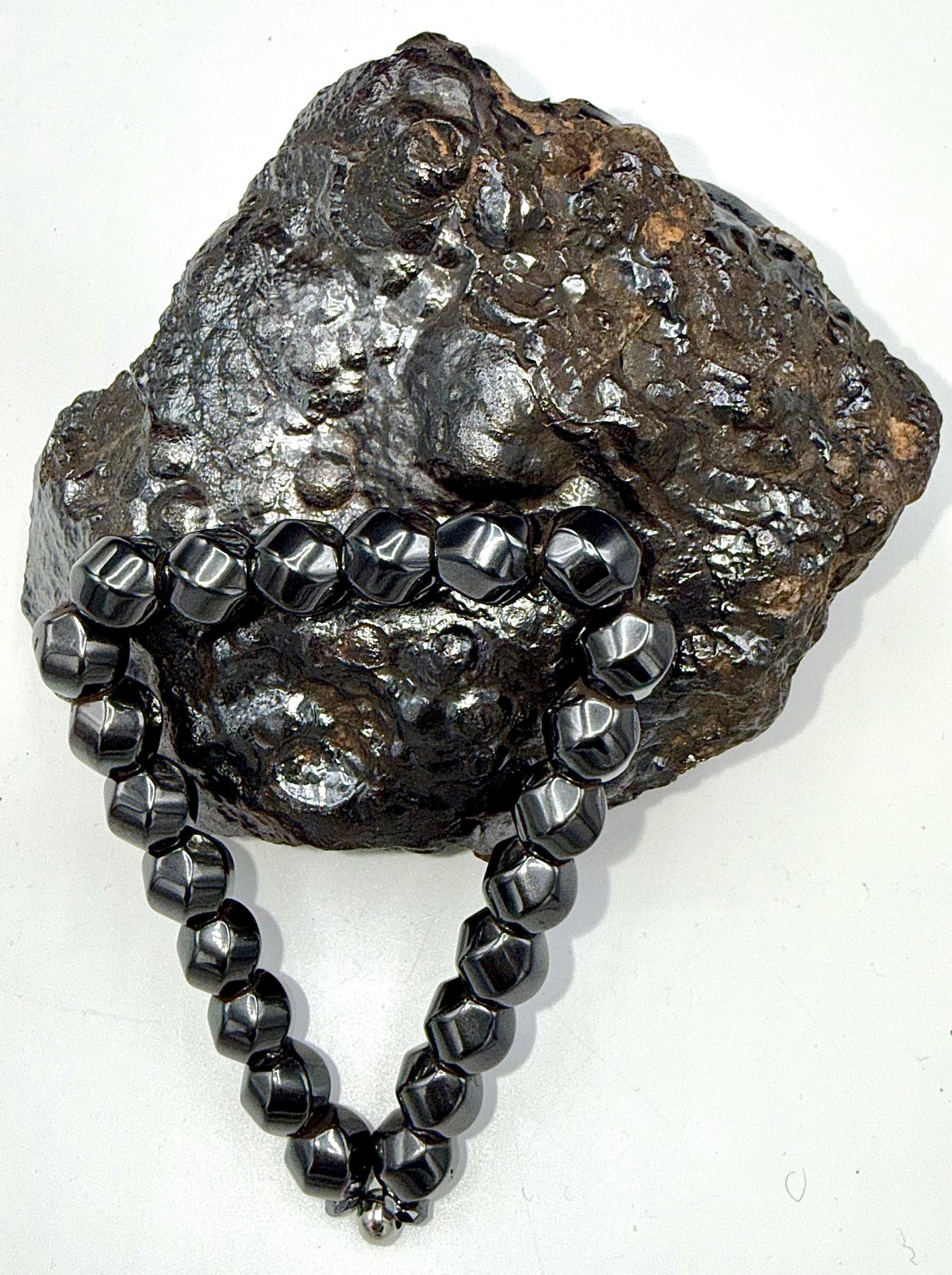 Magnetic hematite bracelet by STICS and STONES featuring sleek, polished black hematite beads on a flexible stretch band.