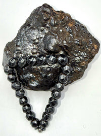 Magnetic hematite bracelet by STICS and STONES featuring sleek, polished black hematite beads on a flexible stretch band.