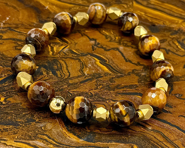 Faceted brown tiger eye bracelet with brass accents from STICS and STONES, showcasing polished gemstones and metal details.