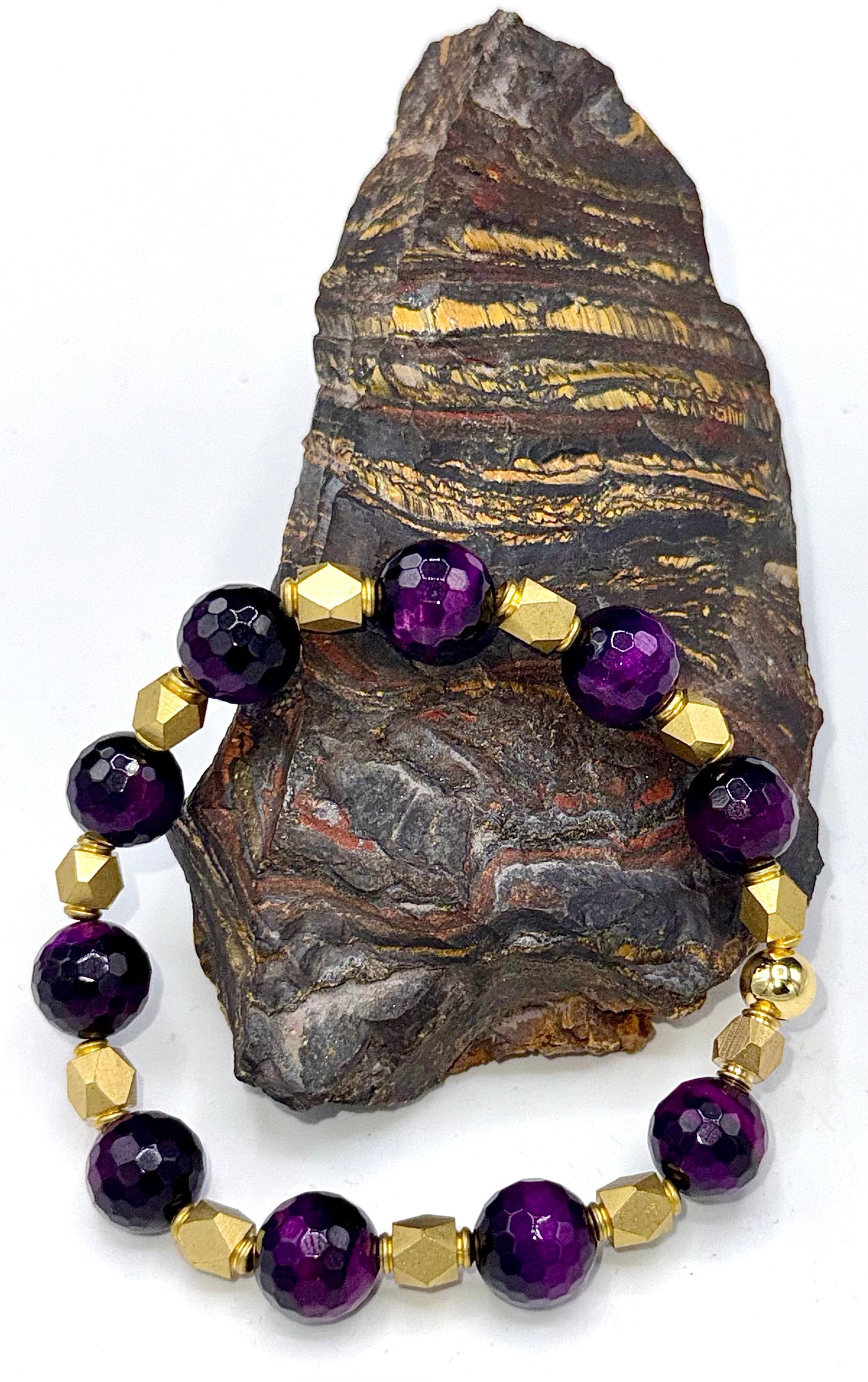 Purple tiger eye beaded bracelet with brass accents from STICS and STONES, featuring polished stones and a stylish design.