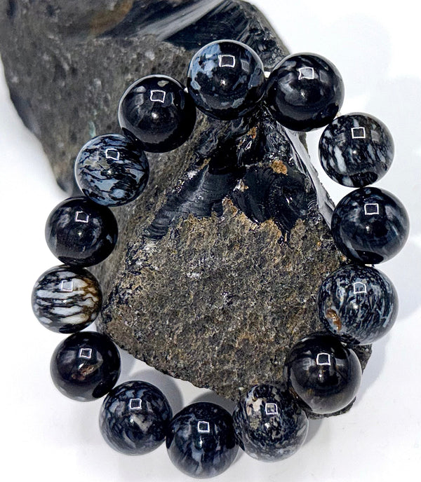 Zebra Jasper bracelet with black and white patterned stones, featuring a stretch elastic band for a stylish accessory.