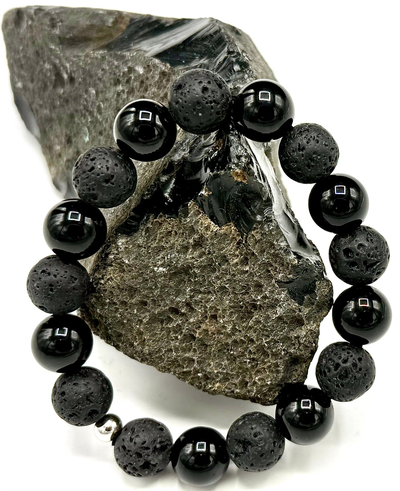 Lava rock and onyx bracelet by STICS and STONES featuring black volcanic stones and polished onyx beads.