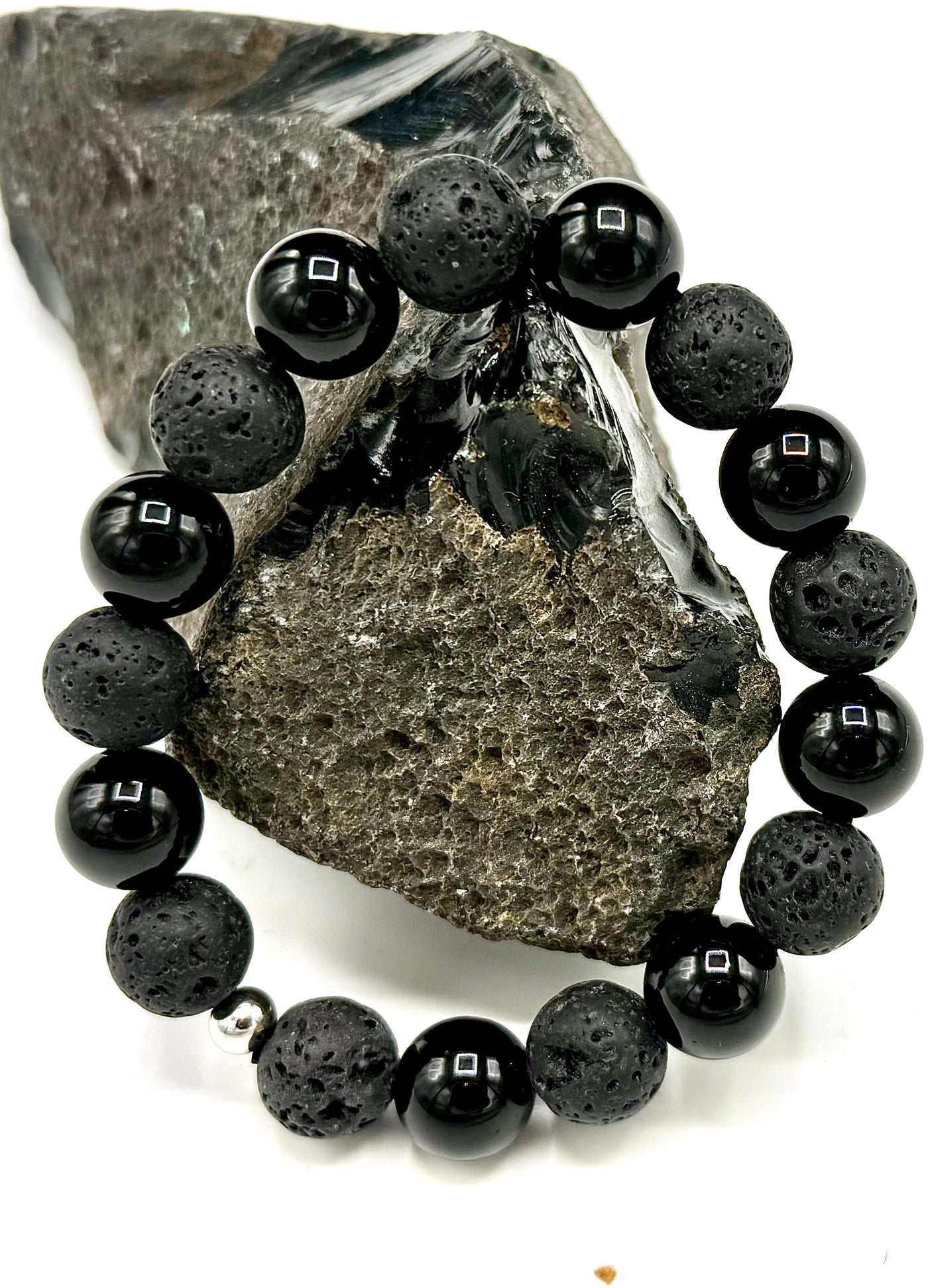 Lava rock, hematite, and onyx bracelet featuring black and gray beads, styled with natural stone textures and a stretch fit design.