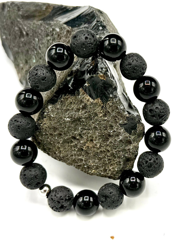 Lava rock, hematite, and onyx bracelet featuring black and gray beads, styled with natural stone textures and a stretch fit design.