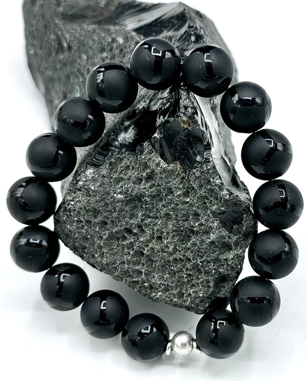 Black Onyx bracelet with intricate design from STICS and STONES, featuring polished black stones and detailed metal accents.