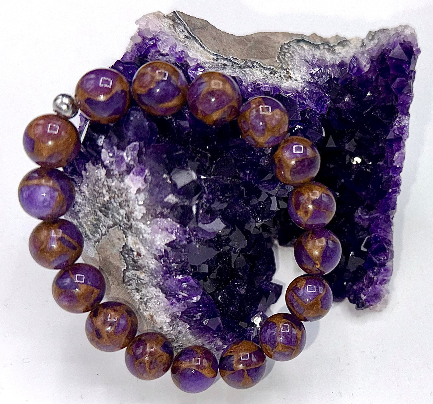 Purple amethyst and gold quartz bracelet featuring polished gemstones, crafted by STICS and STONES.