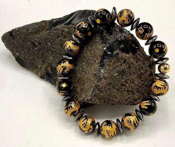 Black Onyx bracelet with intricate gold carving, featuring a stylish design from STICS and STONES.