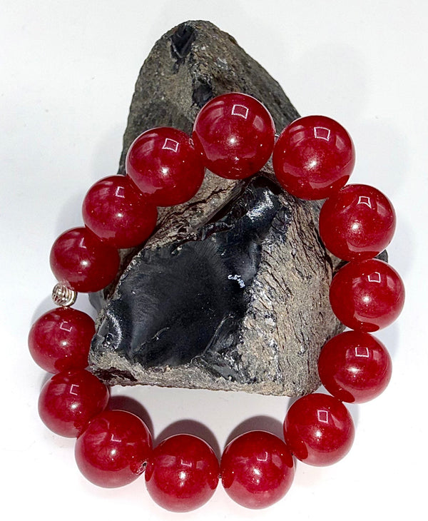 Strawberry Quartz bracelet with polished pink stones on an elastic band, crafted by STICS and STONES.