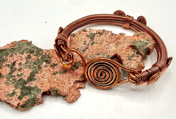 Copper hook-style bracelet from STICS and STONES, featuring a sleek, minimalist design with adjustable hook closure.