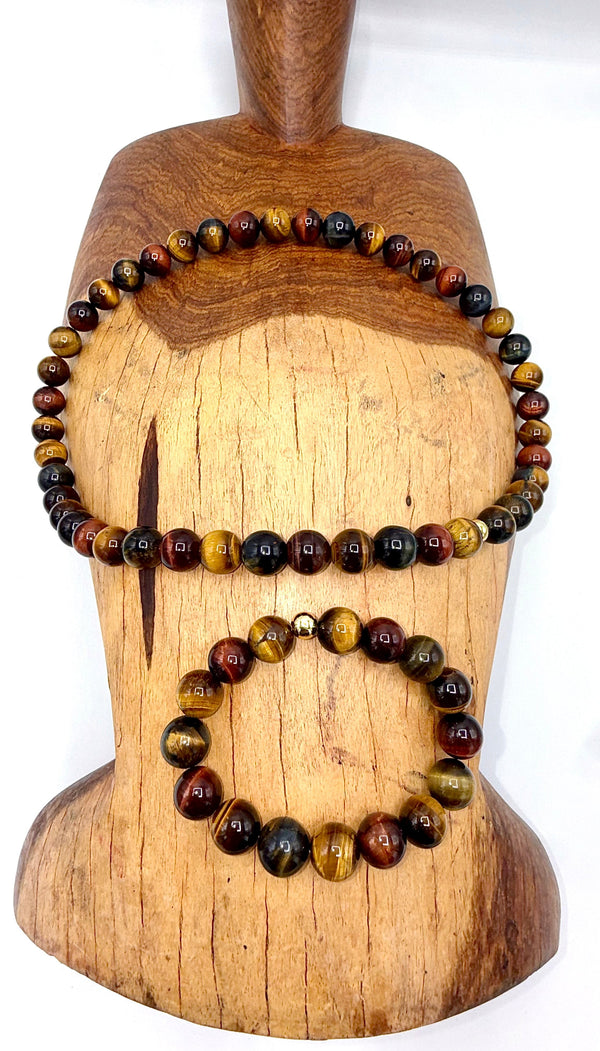 Multi-colored tiger eye jewelry set including a bracelet and necklace from STICS and STONES, featuring polished stone beads.