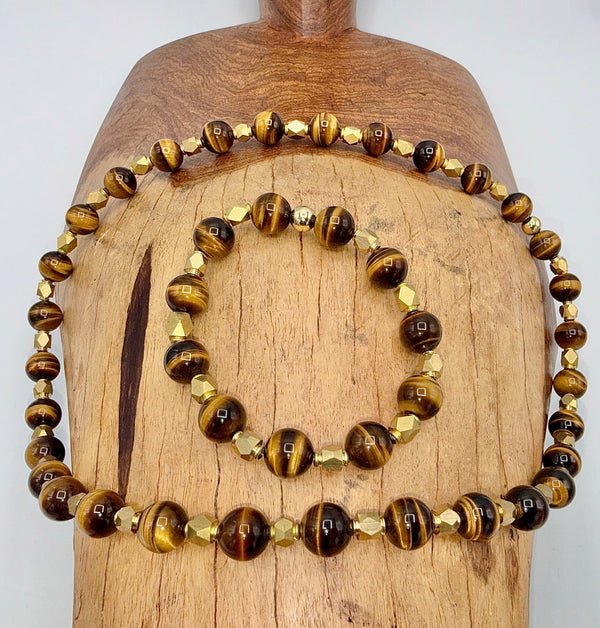 Brown Tiger Eye jewelry set with brass necklace and bracelet, featuring polished stones and intricate metal accents.