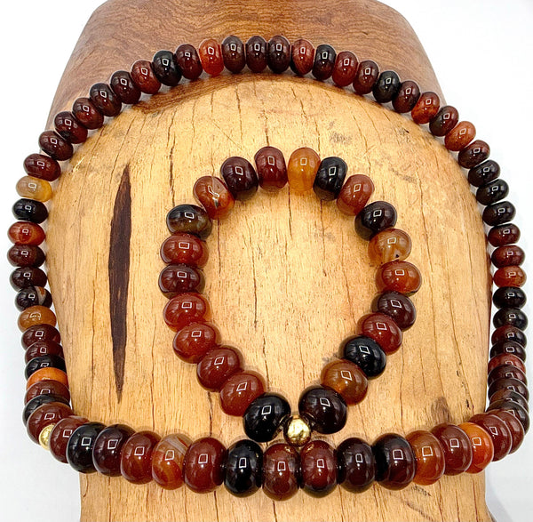 Carnelian jewelry set with matching necklace and bracelet featuring vibrant orange-red stones, by STICS and STONES.