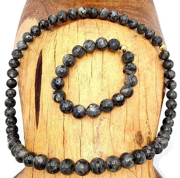 Labradorite jewelry set with necklace and bracelet featuring iridescent stones, crafted by STICS and STONES.