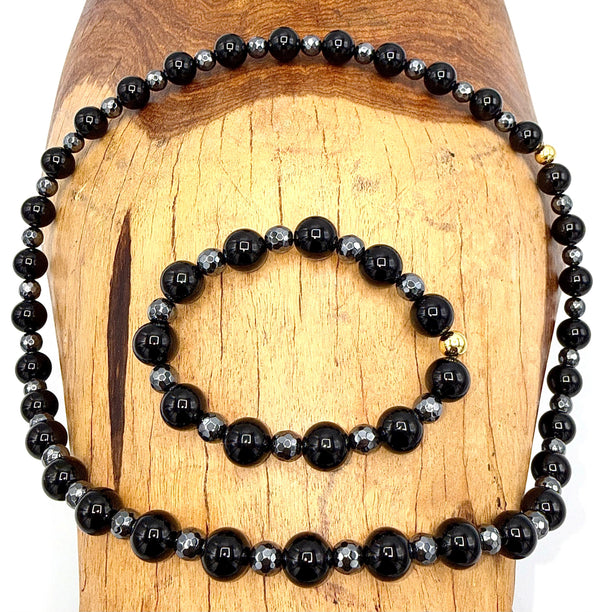 Black Onyx and Hematite jewelry set featuring a necklace and bracelet with polished stones, crafted by STICS and STONES.