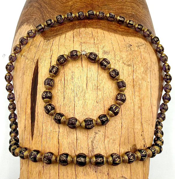Amethyst prayer carved necklace and bracelet jewelry set featuring purple gemstone beads and intricate carved designs.