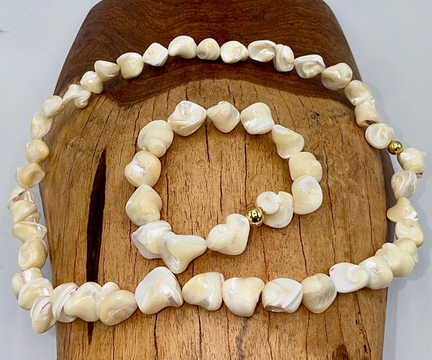 Square-shaped pearl jewelry set including necklace and bracelet by STICS and STONES, featuring elegant pearl designs.
