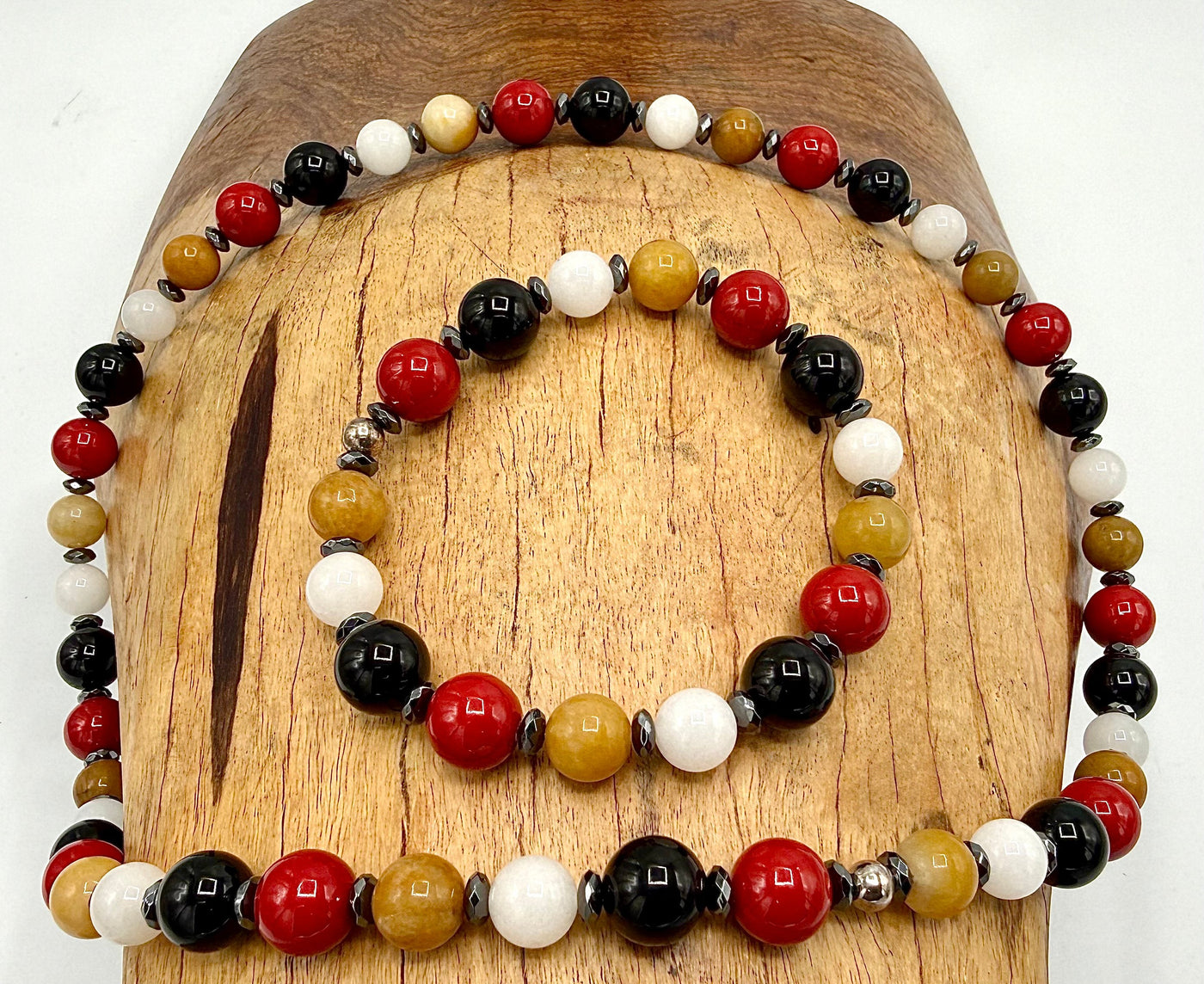 Silver Burberry necklace and bracelet set by STICS and STONES featuring classic pattern and elegant jewelry design.