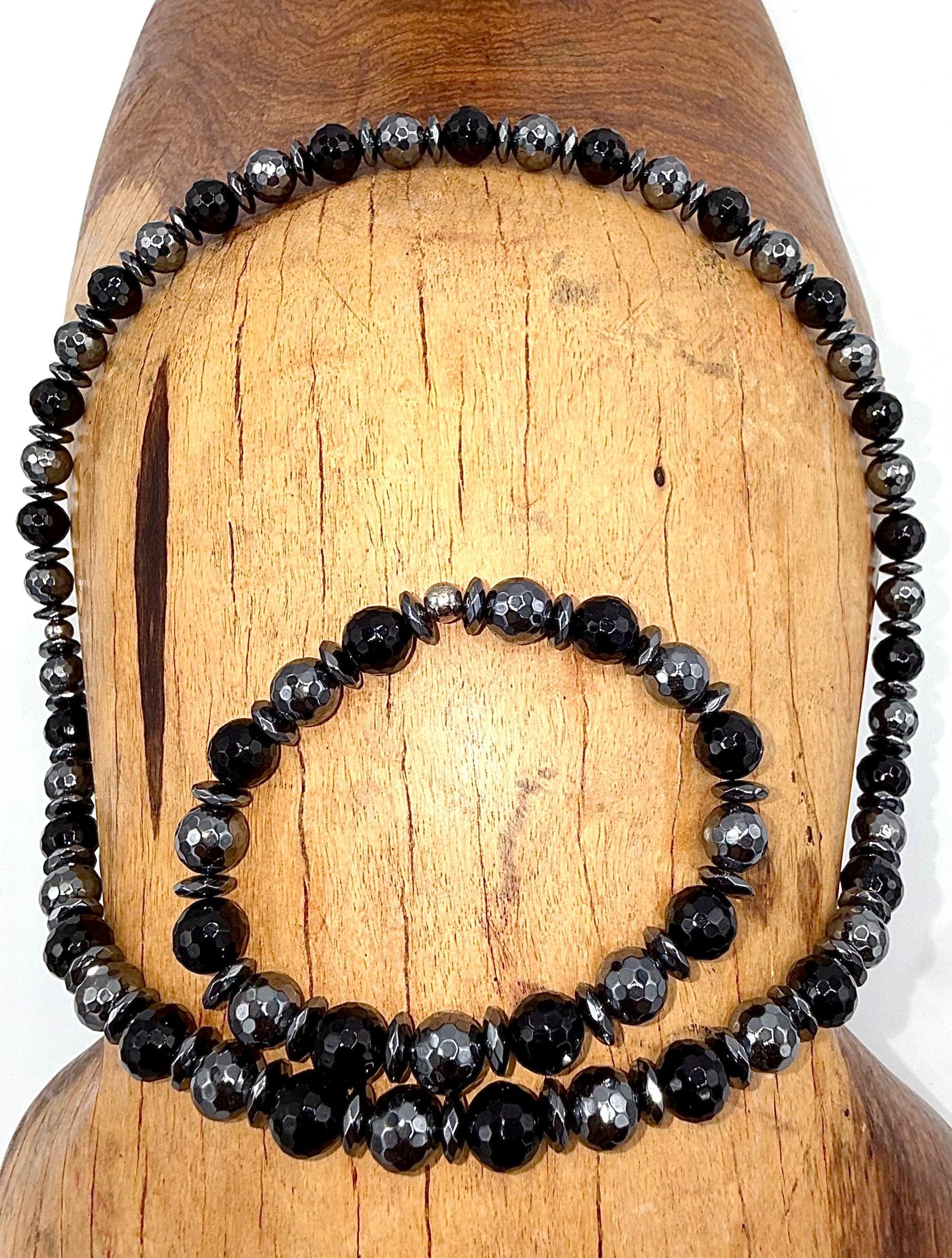 Black Onyx necklace and hematite bracelet jewelry set featuring polished black stones, crafted by STICS and STONES.