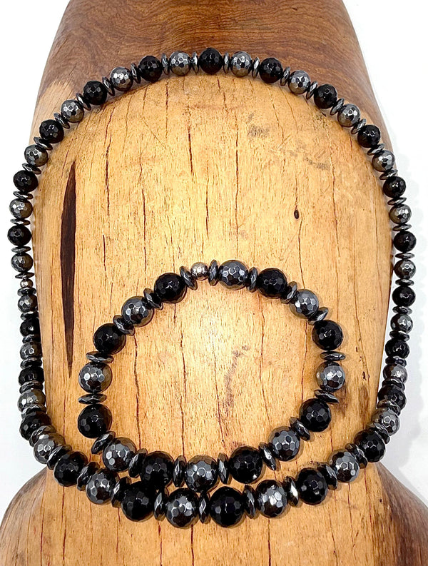 Black Onyx necklace and hematite bracelet jewelry set featuring polished black stones, crafted by STICS and STONES.