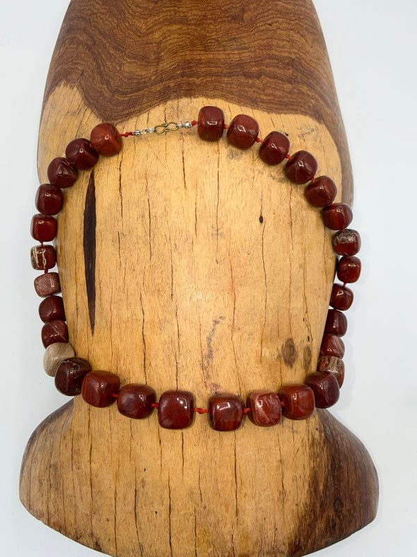 Red Jasper necklace featuring polished beads from STICS and STONES, showcasing a vibrant, handcrafted jewelry piece.